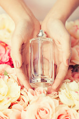 Image showing woman\'s hands showing perfume