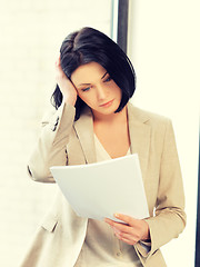 Image showing calm woman with documents