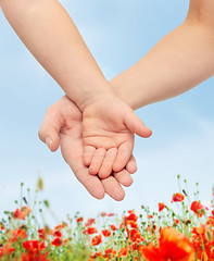 Image showing close up of woman and little child hands together