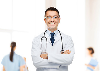 Image showing smiling male doctor in white coat at hospital