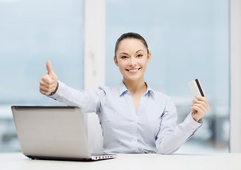 Image showing businesswoman with laptop in office