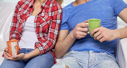 Image showing close up of couple relaxing on sofa in new home