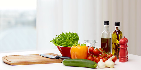 Image showing vegetables, spices and kitchenware on table