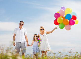 Image showing family with colorful balloons