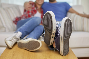 Image showing close up of couple relaxing on sofa in new home