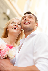 Image showing couple with flowers in the city