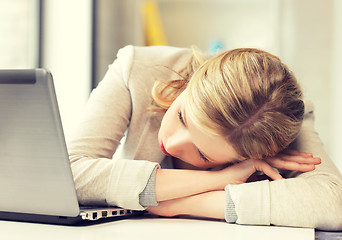 Image showing tired woman with laptop computer