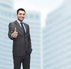 Image showing handsome buisnessman showing thumbs up