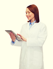 Image showing smiling female doctor and tablet pc computer