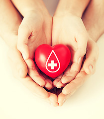 Image showing hands holding red heart with donor sign