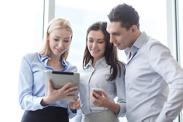 Image showing business team working with tablet pcs in office