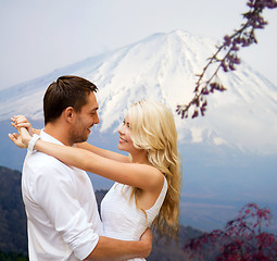 Image showing happy couple hugging over japan mountains