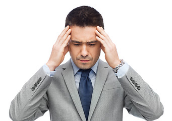 Image showing businessman in suit having head ache