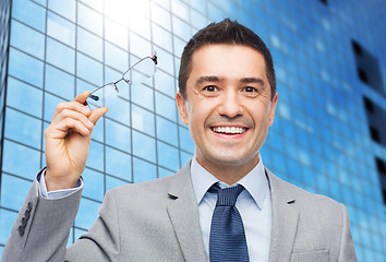 Image showing happy smiling businessman in eyeglasses and suit