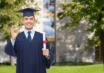 Image showing smiling adult student in mortarboard with diploma