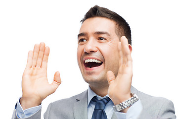 Image showing happy businessman in suit shouting