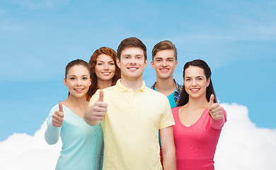 Image showing group of smiling teenagers showing thumbs up