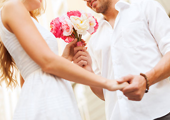 Image showing couple with flowers in the city