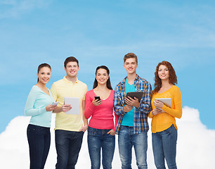 Image showing group of teenagers with smartphones and tablet pc