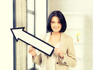 Image showing businesswoman with direction arrow sign