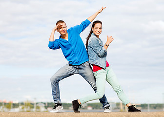 Image showing couple of teenagers dancing outside