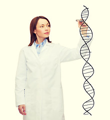 Image showing young female doctor writing dna molecule