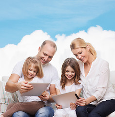 Image showing happy family with tablet pc computers