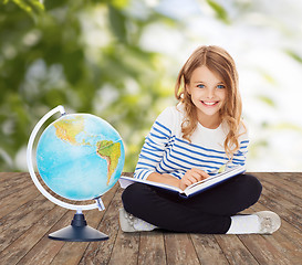 Image showing girl with globe and book