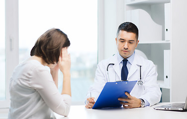 Image showing doctor and young woman meeting at hospital