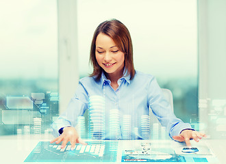 Image showing woman pointing to buttons on virtual screen