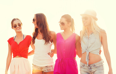 Image showing group of smiling women in sunglasses on beach