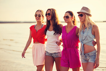 Image showing group of smiling women in sunglasses on beach