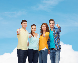 Image showing group of smiling teenagers showing thumbs up