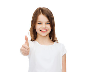 Image showing little girl in blank white tshirt showing thumbsup