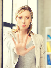 Image showing young woman making stop gesture