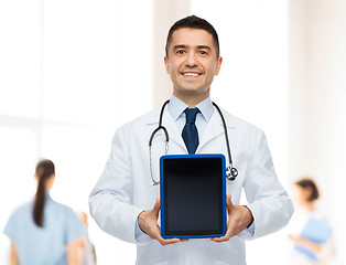 Image showing smiling male doctor with tablet pc at hospital