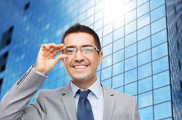 Image showing happy smiling businessman in eyeglasses and suit