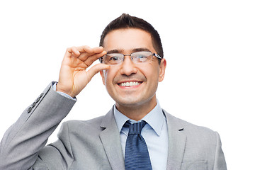 Image showing happy smiling businessman in eyeglasses and suit