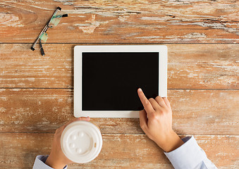 Image showing close up of female hands with tablet pc and coffee