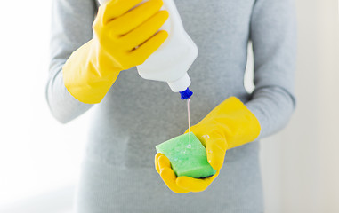 Image showing close up of woman with sponge and cleanser