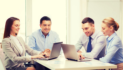 Image showing business team working with laptop in office