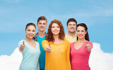 Image showing group of smiling teenagers showing thumbs up