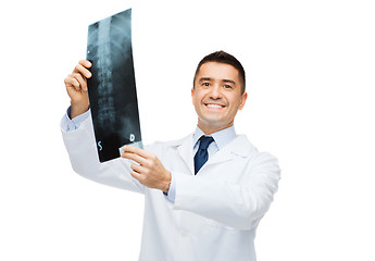 Image showing smiling male doctor in white coat holding x-ray