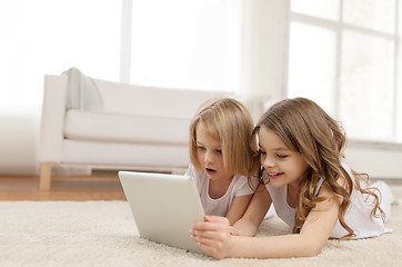 Image showing two little girls with tablet pc at home