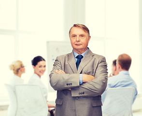 Image showing serious businessman or teacher in suit