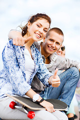 Image showing teenages with skateboard outside