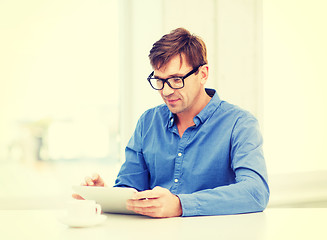 Image showing man working with tablet pc at home