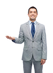 Image showing happy smiling businessman in suit