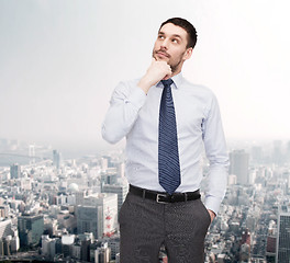 Image showing handsome businessman looking up