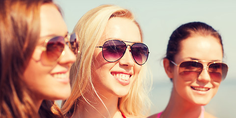 Image showing close up of smiling young women in sunglasses